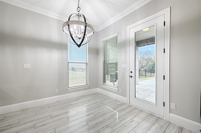 unfurnished dining area with an inviting chandelier and ornamental molding