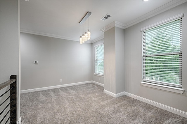 carpeted spare room with a notable chandelier and crown molding