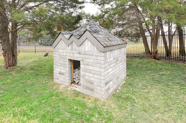 view of outdoor structure with a lawn