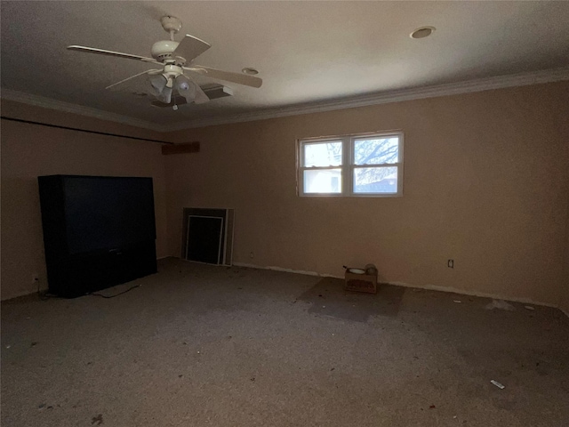 spare room with ceiling fan and ornamental molding