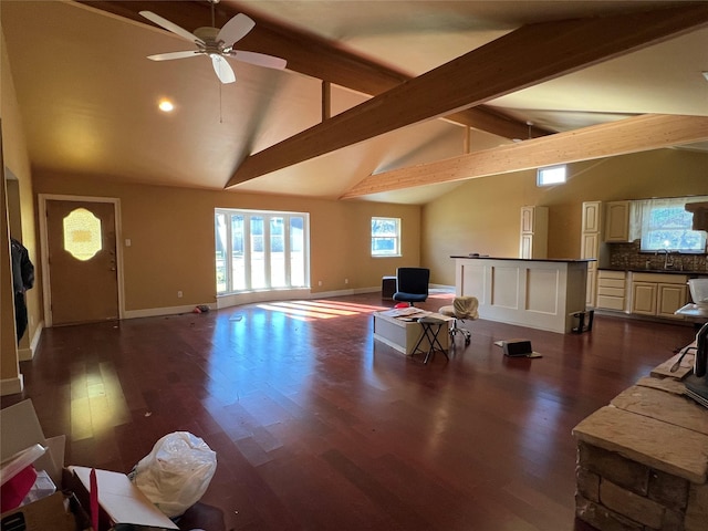 interior space with ceiling fan, high vaulted ceiling, sink, and dark hardwood / wood-style flooring