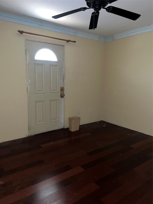 entrance foyer featuring crown molding, dark hardwood / wood-style floors, and ceiling fan