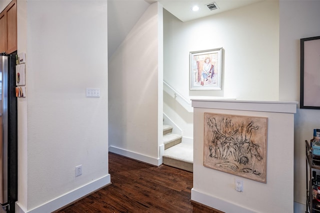 stairs featuring hardwood / wood-style floors