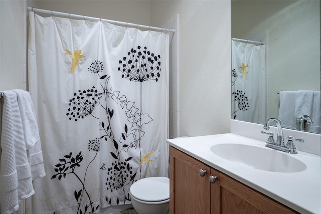 bathroom with vanity, toilet, and a shower with shower curtain