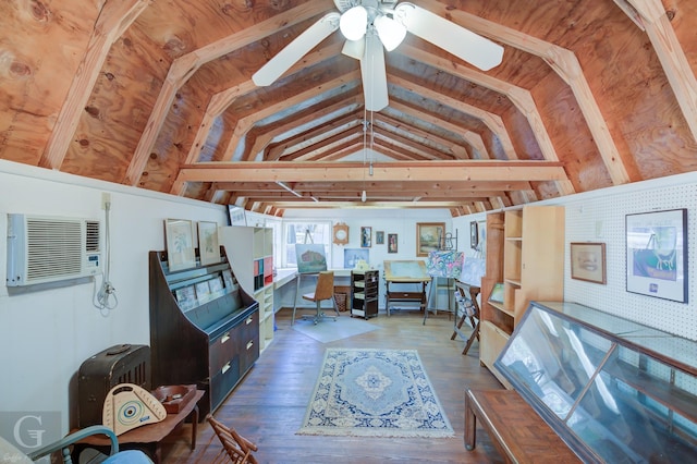 storage room with an AC wall unit and ceiling fan