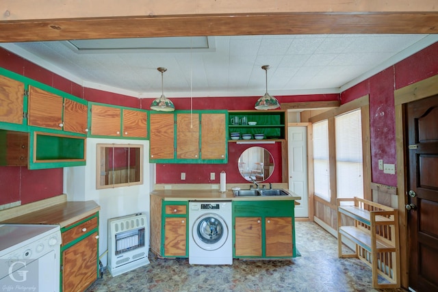 kitchen featuring sink, heating unit, hanging light fixtures, dishwasher, and washer / clothes dryer