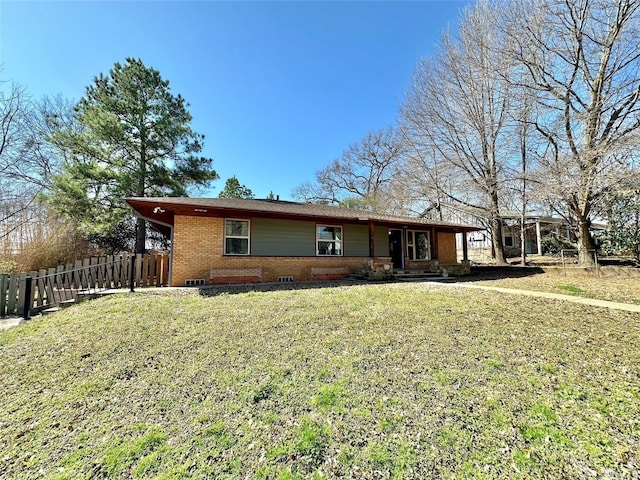 ranch-style home featuring a front lawn