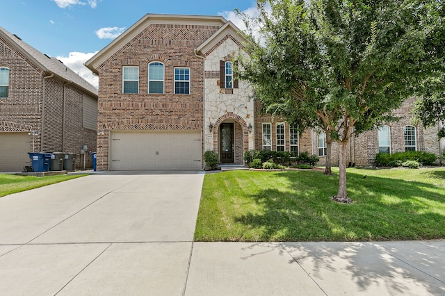 view of front of home featuring a garage and a front yard