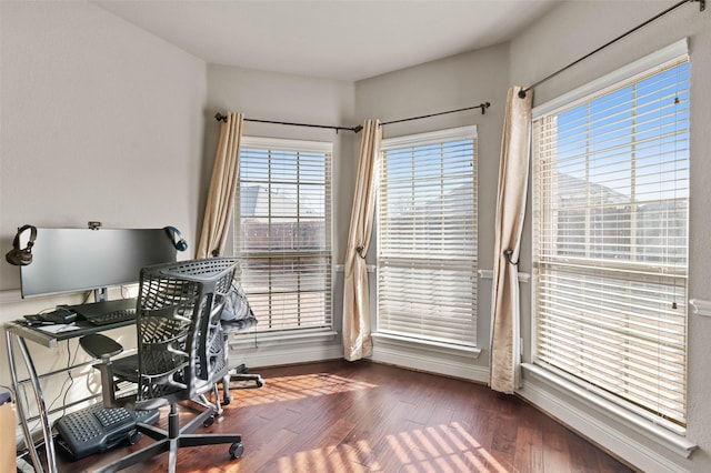 office featuring baseboards and wood finished floors