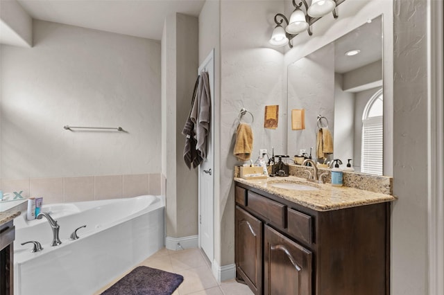 bathroom featuring vanity, tile patterned flooring, and a bathing tub