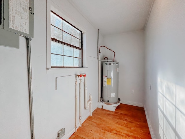 utility room featuring electric water heater