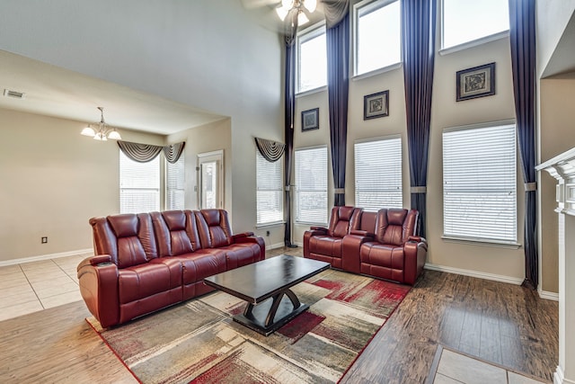 living room featuring visible vents, wood finished floors, and a wealth of natural light