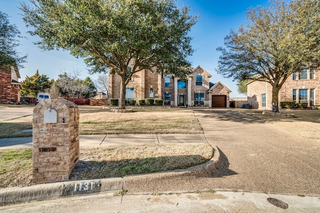 exterior space with stone siding and concrete driveway