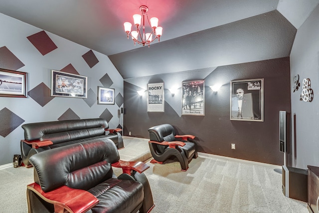 home theater with carpet floors, an inviting chandelier, baseboards, and vaulted ceiling