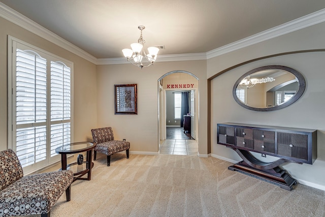 living area with crown molding, visible vents, an inviting chandelier, light carpet, and baseboards