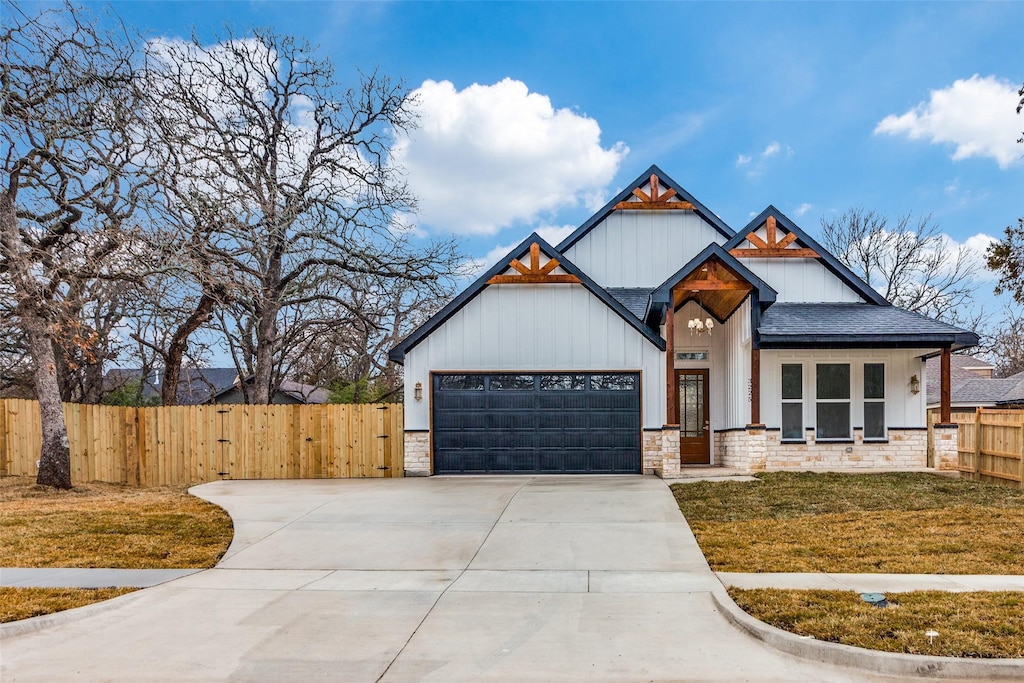 view of front of home with a garage and a front yard