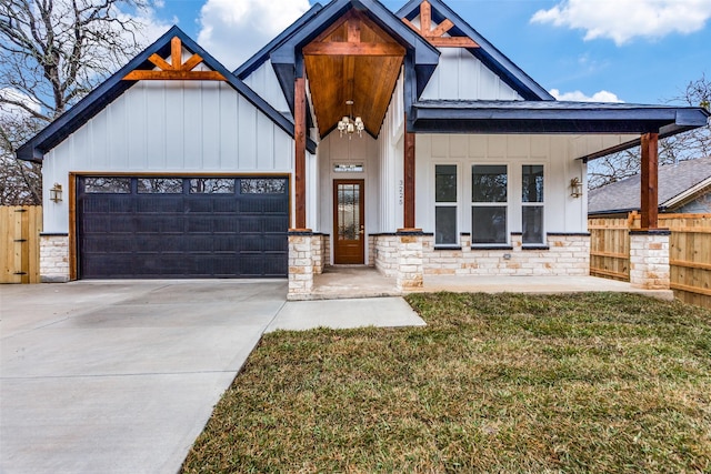 view of front of property with a garage and a front yard