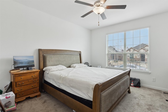 bedroom featuring light carpet and ceiling fan