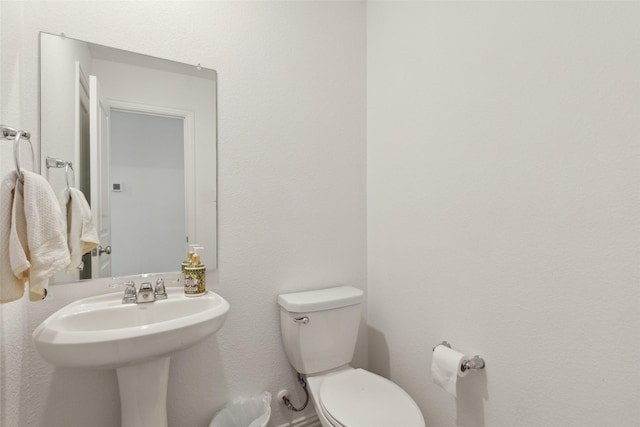 bathroom featuring toilet