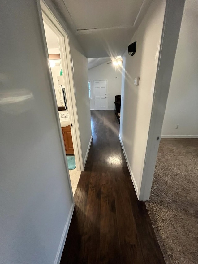 corridor with dark wood-type flooring