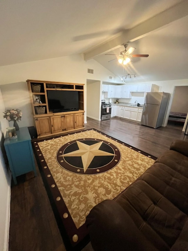 living room with sink, vaulted ceiling with beams, track lighting, dark hardwood / wood-style flooring, and ceiling fan