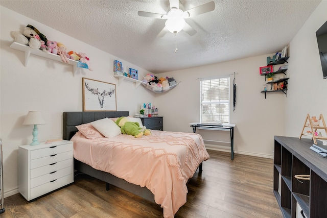 1714 Vz County Road 2142 Unit 2142, Wills Point, TX 75169 - bedroom featuring a textured ceiling, wood finished floors, and a ceiling fan