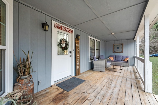 exterior space featuring a porch and outdoor lounge area