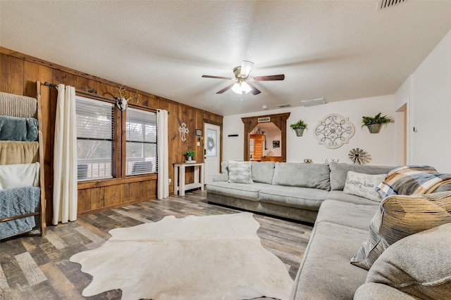 1714 Vz County Road 2142 Unit 2142, Wills Point, TX 75169 - living area featuring wood walls, wood finished floors, and ceiling fan