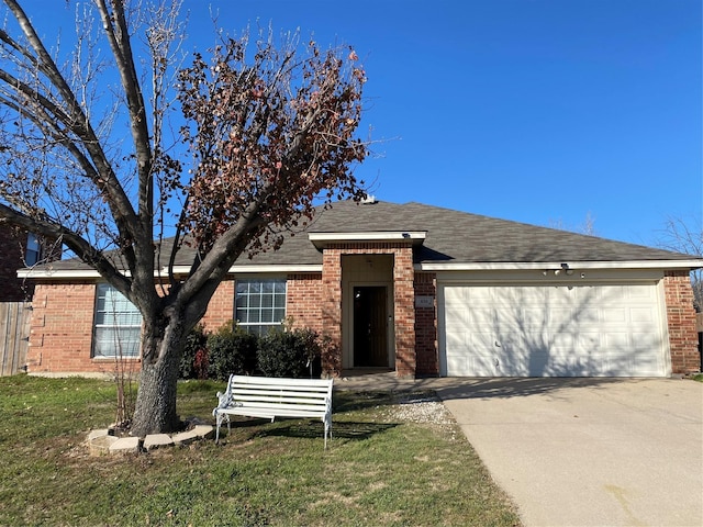 single story home with a garage and a front lawn