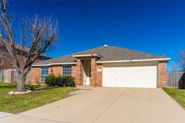 single story home featuring a garage and a front lawn