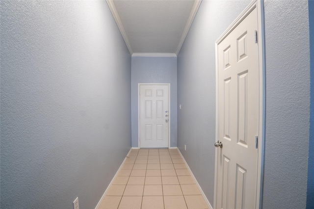 doorway with light tile patterned floors and ornamental molding