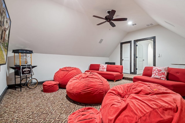 cinema room featuring lofted ceiling and carpet floors