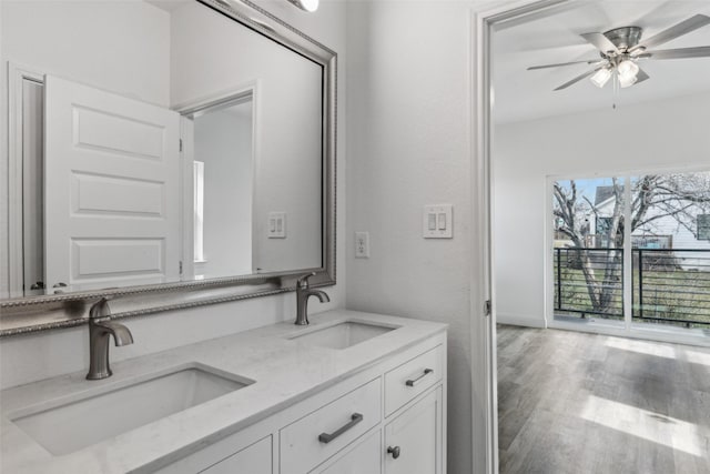 bathroom featuring hardwood / wood-style flooring, vanity, and ceiling fan