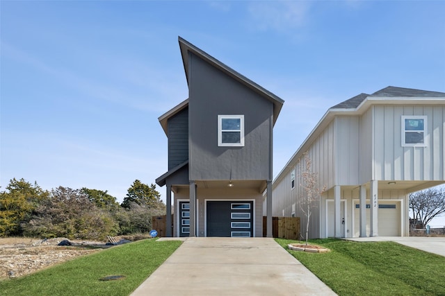 view of front of home featuring a garage and a front lawn