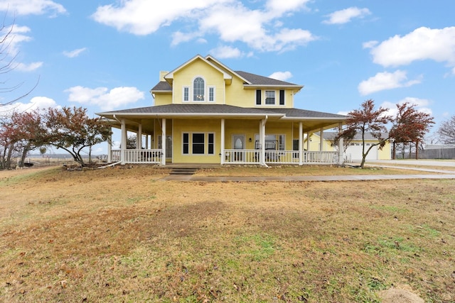 farmhouse with covered porch and a front lawn