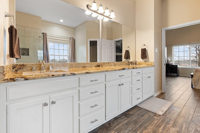 bathroom with vanity and hardwood / wood-style floors