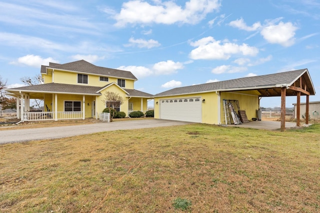 view of front of home with a porch, a garage, and a front lawn