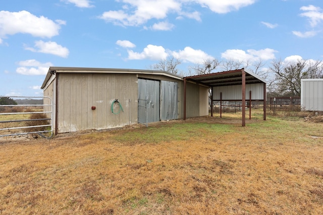 view of outdoor structure with a yard