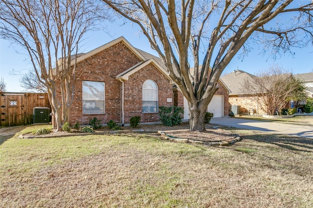 view of front of home featuring a garage, cooling unit, and a front lawn