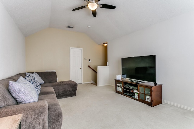 carpeted living room featuring ceiling fan and lofted ceiling