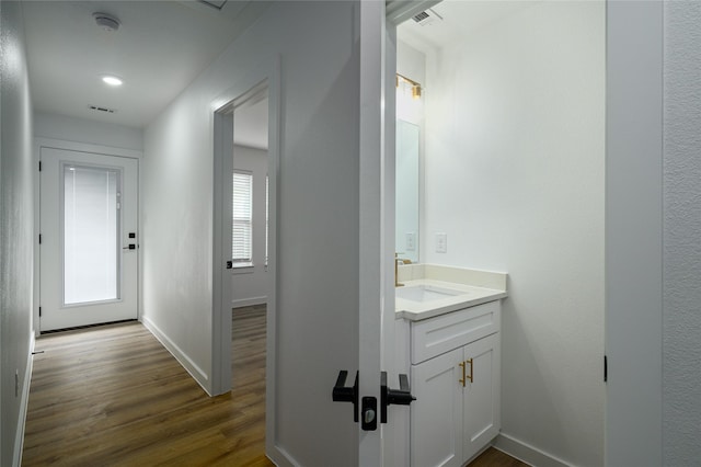 bathroom featuring vanity and hardwood / wood-style flooring