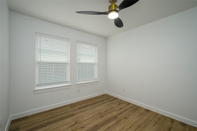 empty room featuring hardwood / wood-style floors and ceiling fan