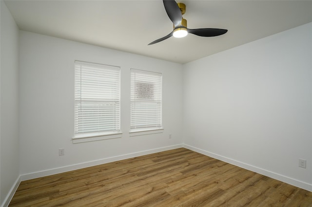 spare room featuring ceiling fan and light hardwood / wood-style flooring