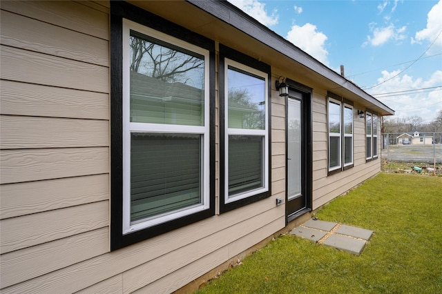 view of side of home featuring a yard