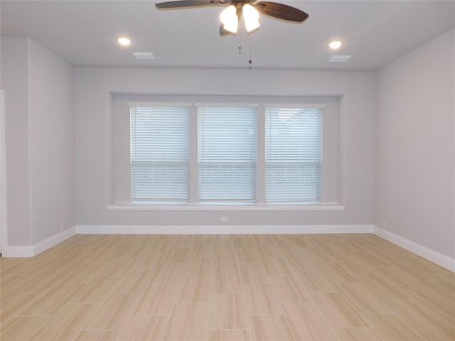 unfurnished room with ceiling fan