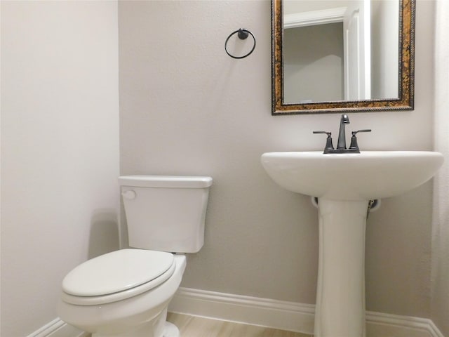 bathroom with sink and toilet