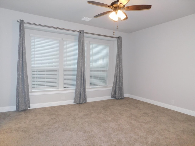 carpeted empty room with ceiling fan