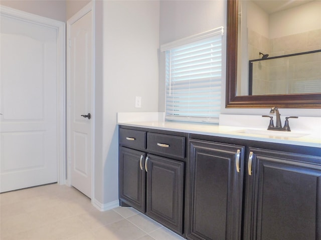 bathroom with vanity and a shower with shower door