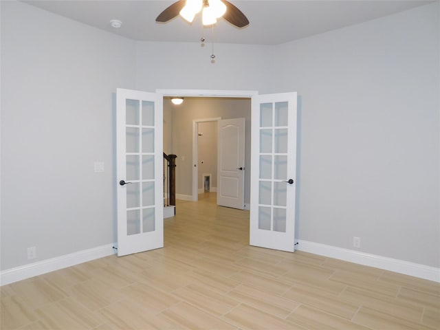 spare room with light hardwood / wood-style floors, french doors, and ceiling fan