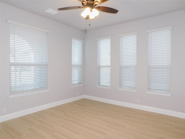 empty room featuring light hardwood / wood-style floors and ceiling fan